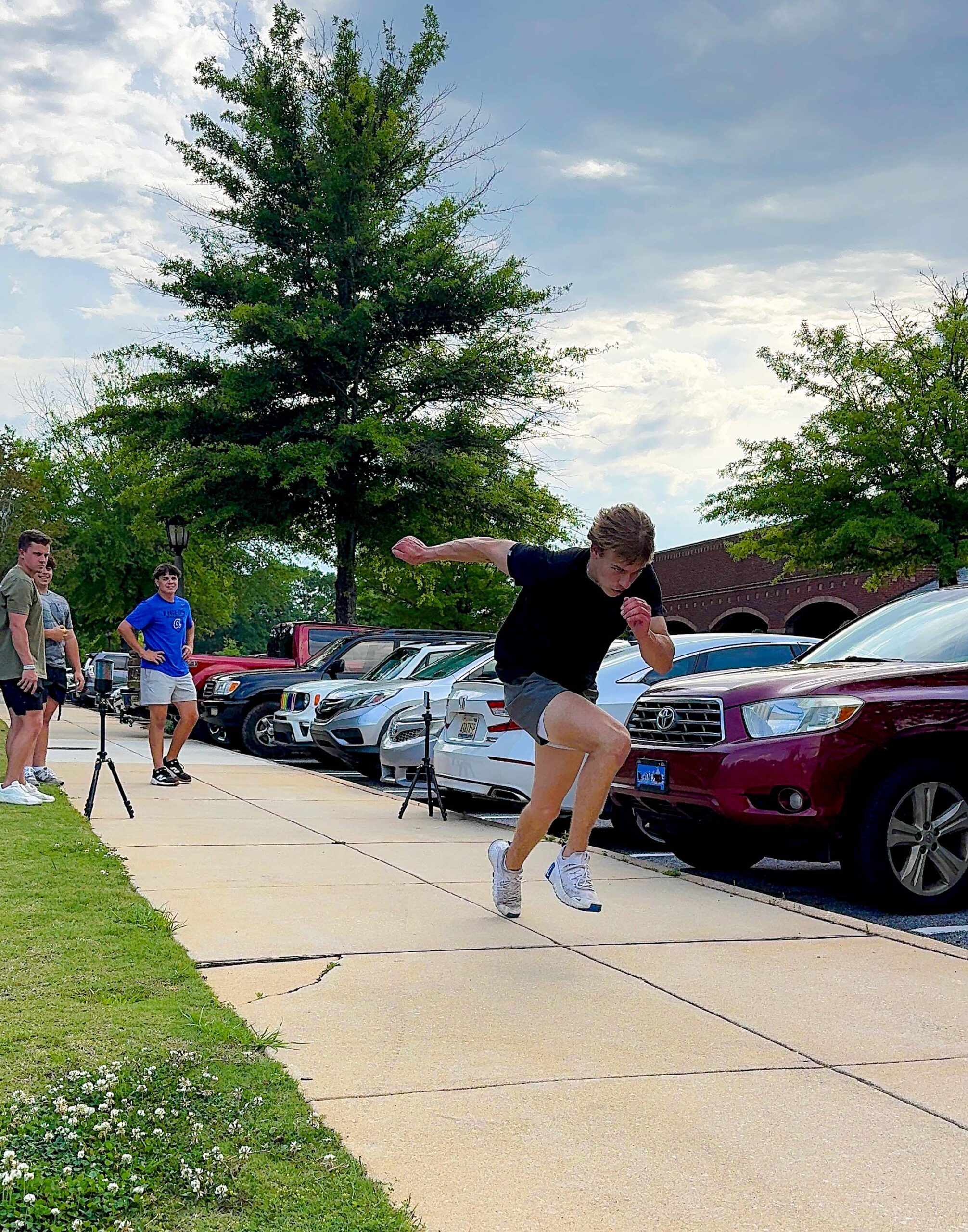 A young athlete sprinting outdoors during a GRIT speed training session